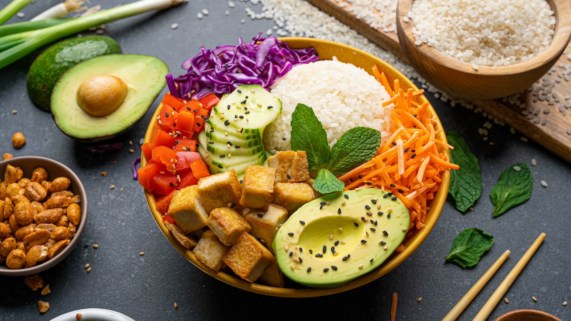 Lundberg sushi rice with fresh vegetable ingredients in bowl.